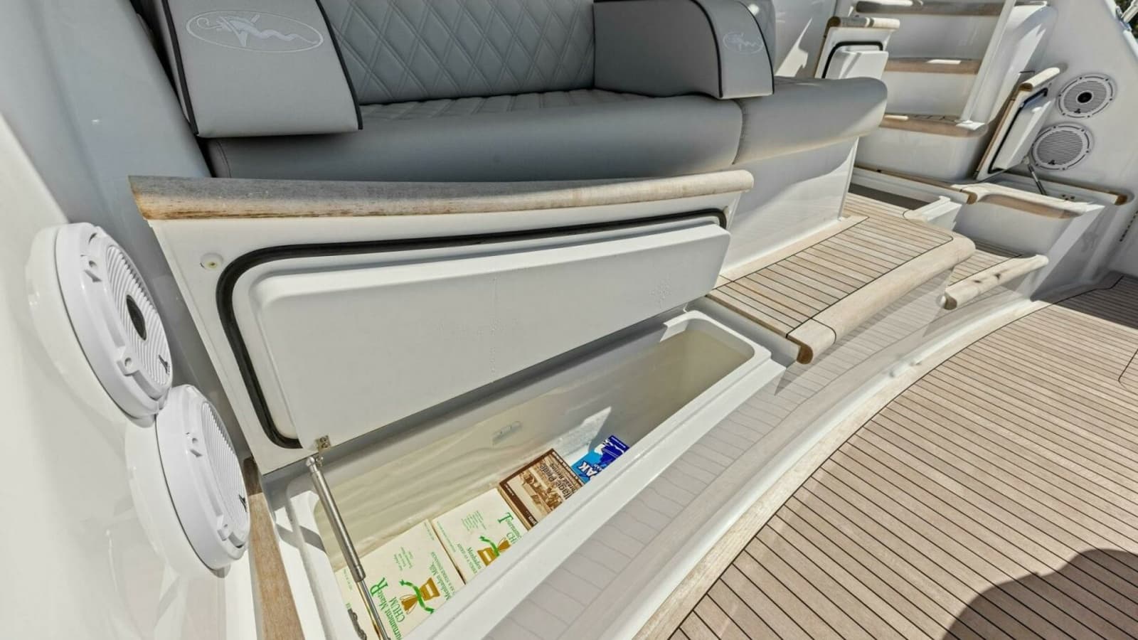 2023 Viking 54 Convertible "Olde Floridian" - Accessible Storage, Perfect for Stowing Essentials While Enjoying Time on the Water. The Teak Decking Adds a Touch of Classic Luxury.