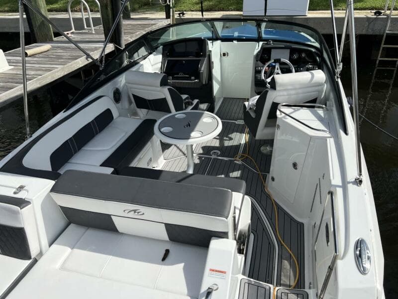 2022 Monterey M-45 boat interior with seating, table, and helm station.