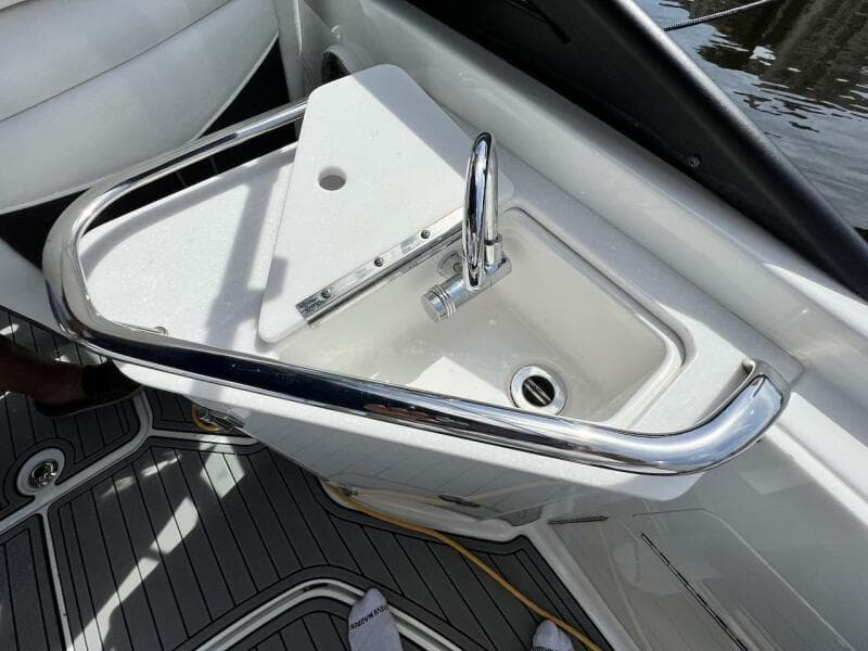 2022 Monterey M-45 boat sink with chrome faucet and safety rail.