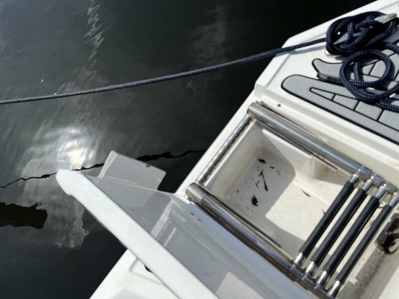 Monterey M-45 2022 boat ladder and deck with rope on water.