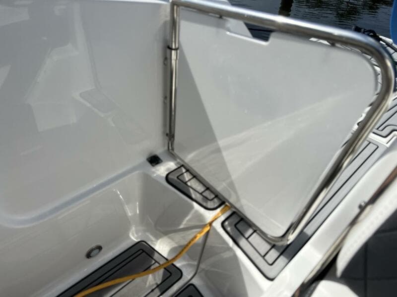 Monterey M-45 2022 boat interior with open gate and yellow cable.