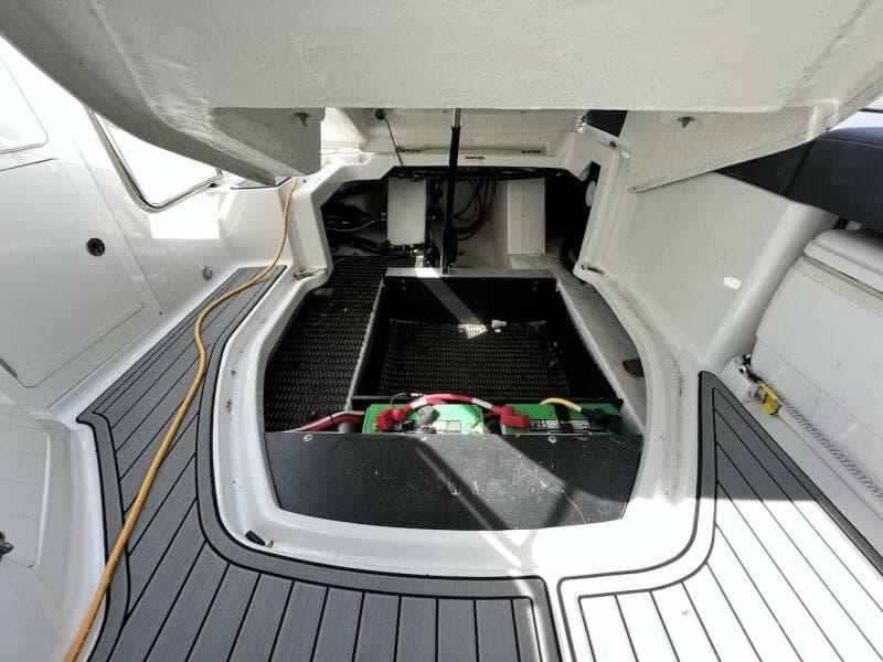 2022 Monterey M-45 boat engine compartment with open hatch and visible battery.