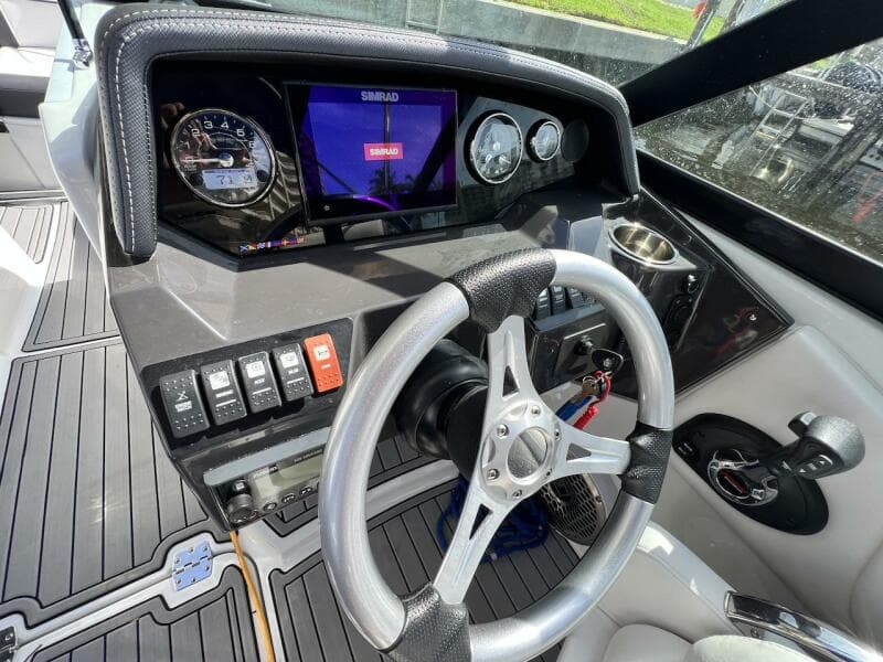 Cockpit of 2022 Monterey M-45 boat with steering wheel, gauges, and control panel.