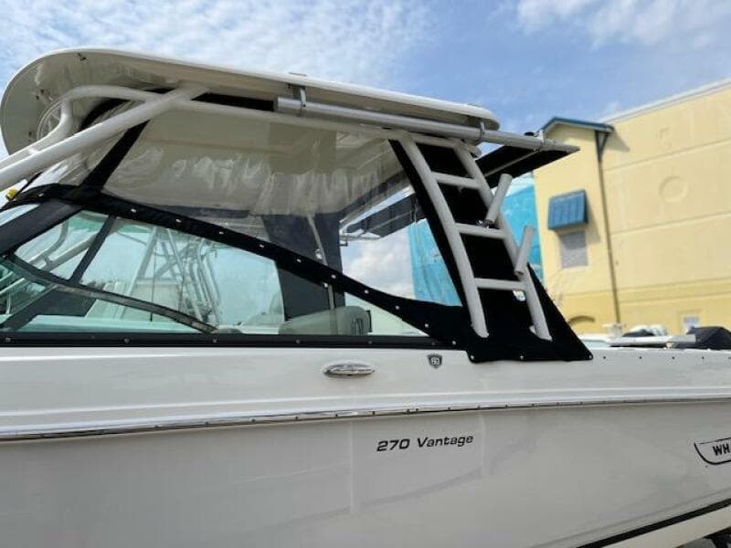 2018 Boston Whaler 270 Vantage boat side view with hardtop and clear skies.