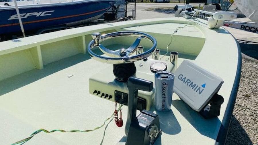 1983 Maverick 18 Flats Boat with Garmin navigation system and steering wheel.