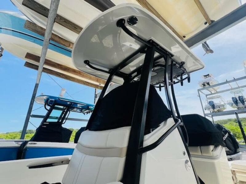 2023 Boston Whaler 250 Dauntless boat interior with T-top and seating.