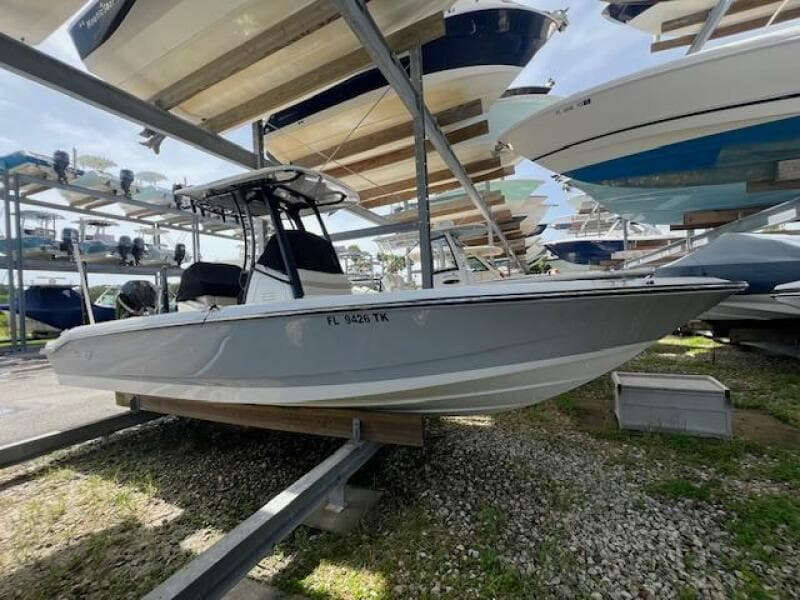 2023 Boston Whaler 250 Dauntless boat on storage rack, side view.