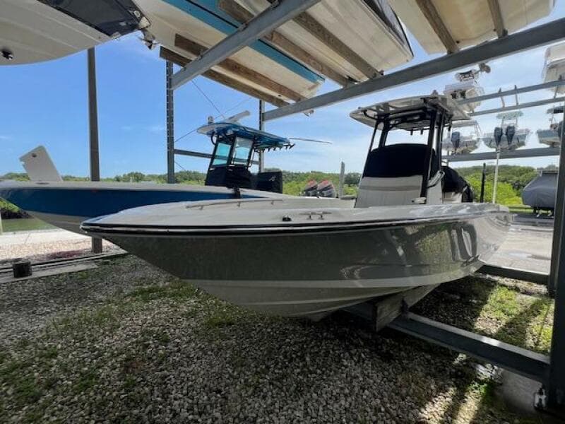 2023 Boston Whaler 250 Dauntless boat in storage, side view.