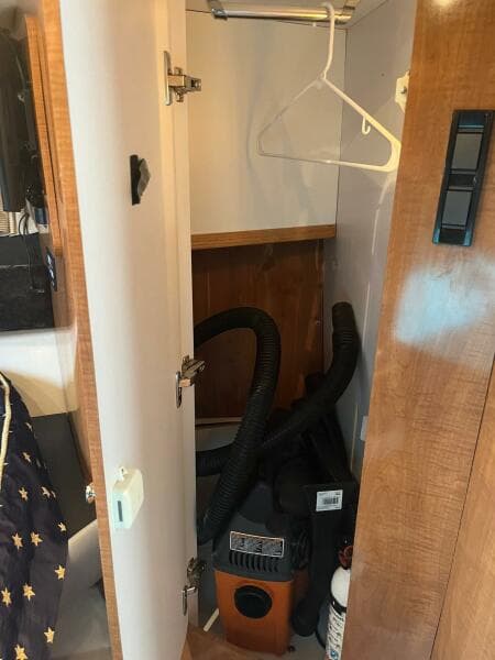 2003 Regal Commodore 3860 closet with vacuum and hanger.