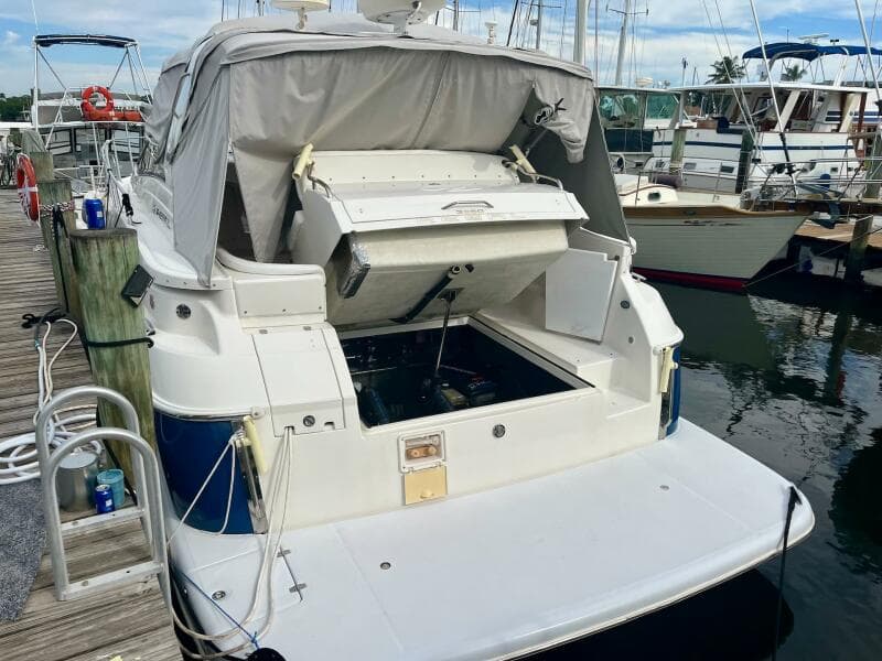2003 Regal Commodore 3860 yacht docked with engine compartment open.