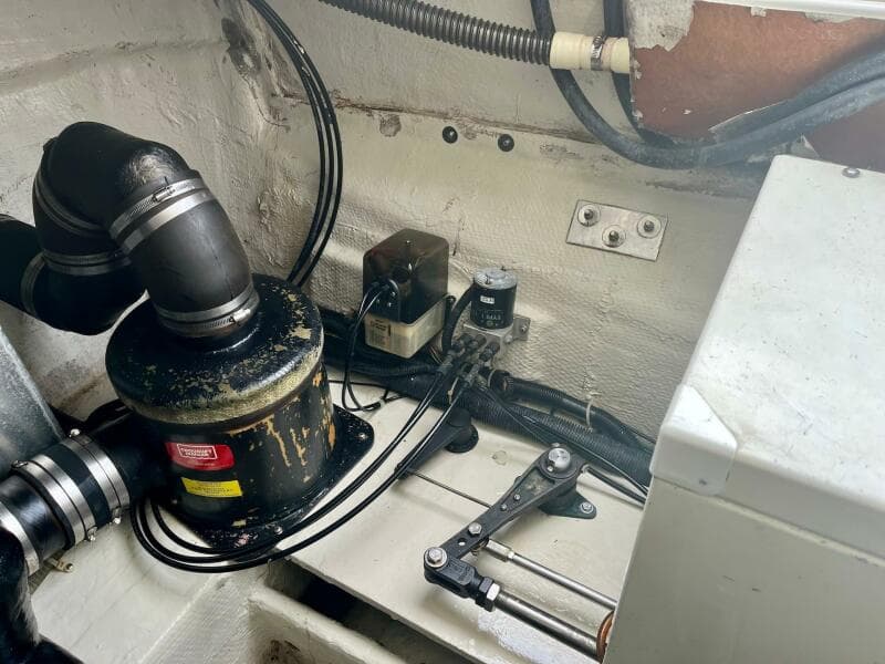 Engine compartment of a 2003 Regal Commodore 3860 boat with various mechanical components.