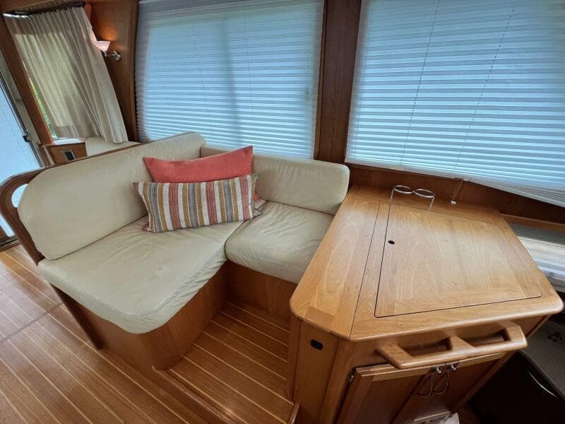 2013 Sabre 48 Salon Express interior with cozy seating and wooden table.