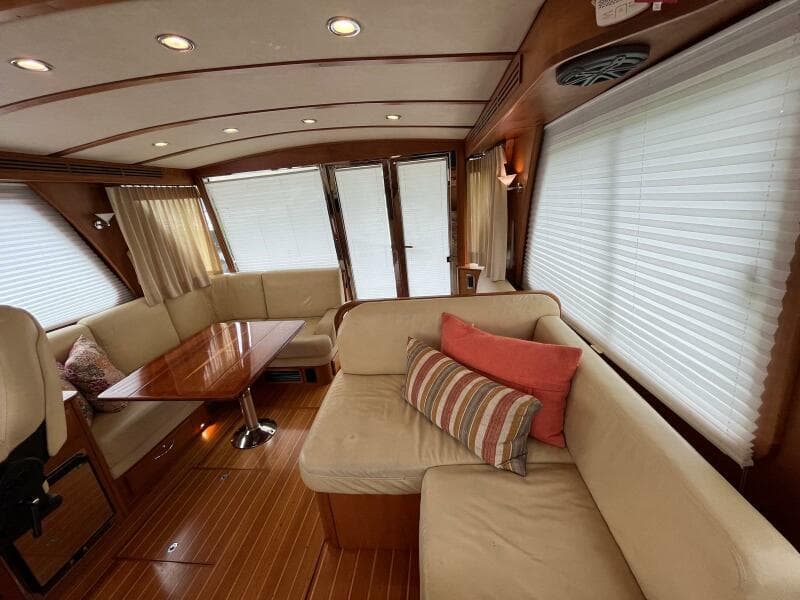 Interior of 2013 Sabre 48 Salon Express yacht with elegant seating and wooden flooring.