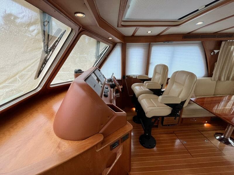 Interior of 2013 Sabre 48 Salon Express yacht with leather seats and wooden finishes.