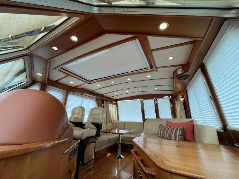 Interior of 2013 Sabre 48 Salon Express yacht with luxurious seating and wood finishes.