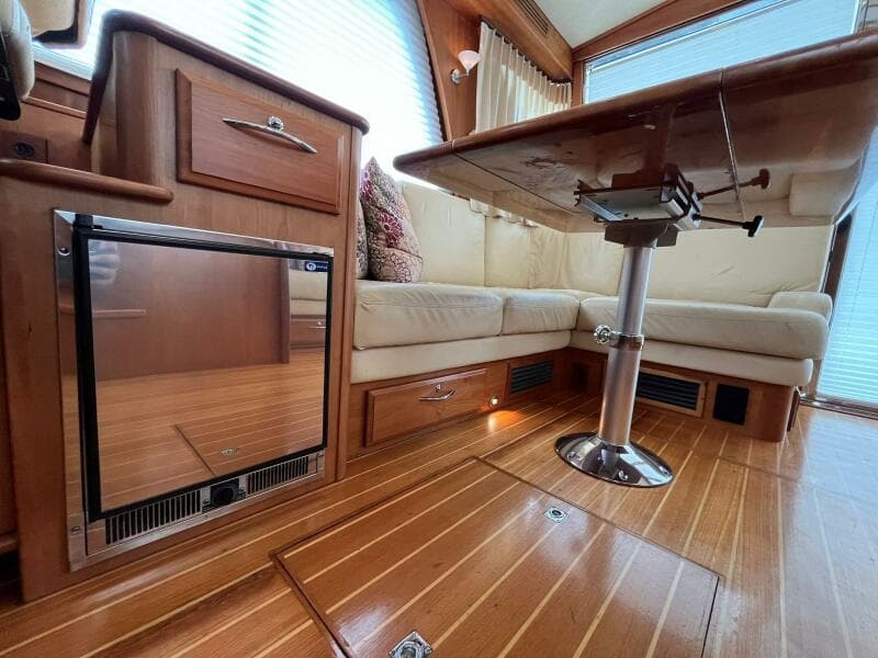 2013 Sabre 48 Salon Express interior with wood flooring and cozy seating area.