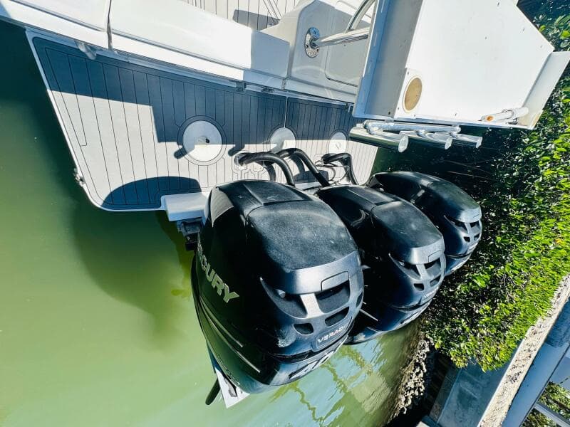 2000 Luhrs Tournament 320 Open with triple Mercury outboard engines.