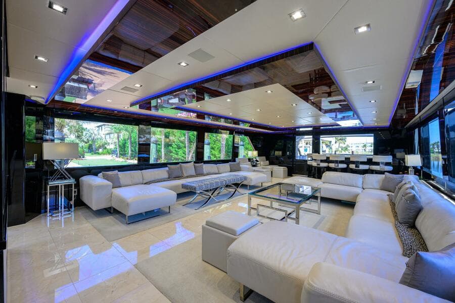Luxurious interior of 1997 Broward 108 Raised Pilothouse yacht with modern furnishings.