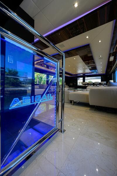 Luxurious interior of 1997 Broward 108 Raised Pilothouse yacht with modern lighting.