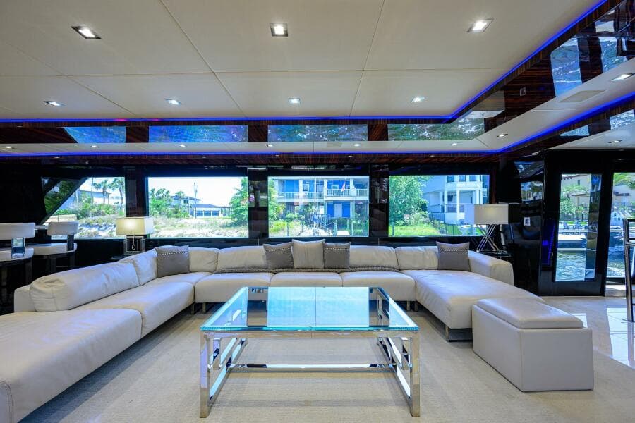 Luxurious interior of 1997 Broward 108 Raised Pilothouse yacht with modern furnishings.