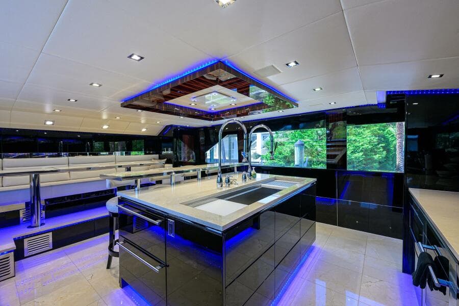 Luxurious kitchen interior of 1997 Broward 108 Raised Pilothouse yacht with modern fixtures.
