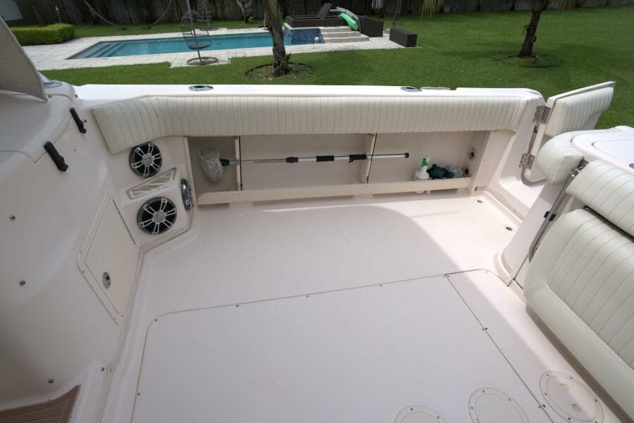 2007 Grady-White Express 330 boat interior with seating and speakers, near a pool.