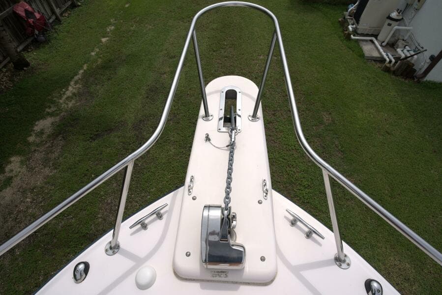 Bow of 2007 Grady-White Express 330 with anchor chain and railing.