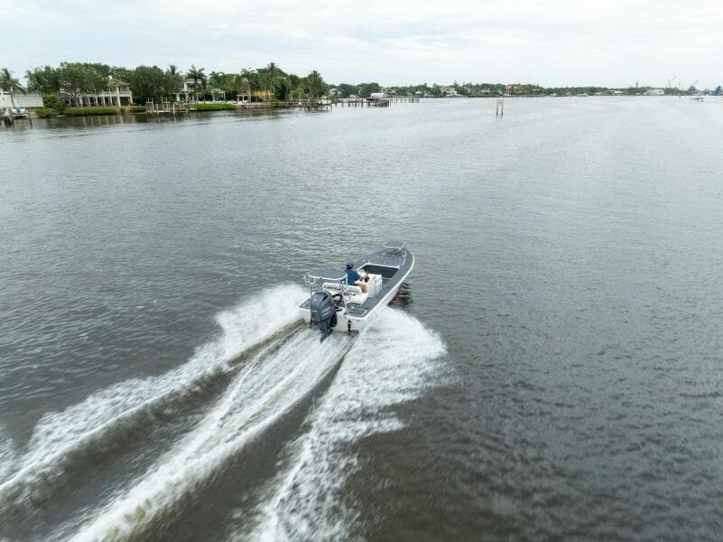 2025 BlueZones Boatworks 16' Flats cruising on a calm river.