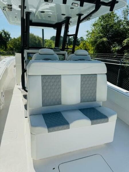 2022 Invincible 36 Open Fisherman boat with cushioned seating and modern design.