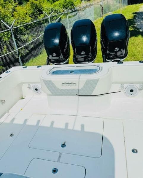 2022 Invincible 36 Open Fisherman boat with triple outboard engines.