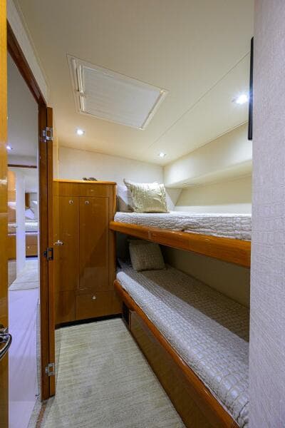 2004 Viking 65 Enclosed Bridge w/Tower bunk bed cabin interior