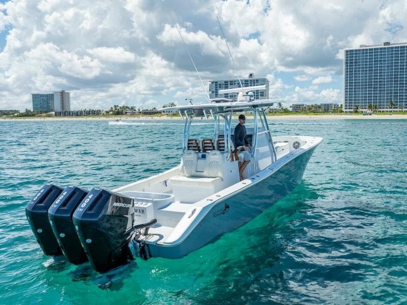 2025 Billfish 39 Center Console boat with tower on clear blue water.
