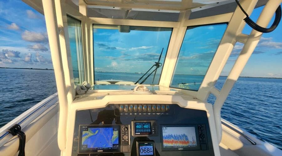 2021 Sailfish 272 CC boat dashboard with navigation screens on open water.