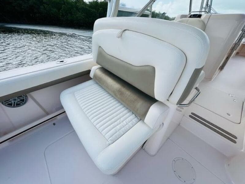 2014 Grady-White Freedom 335 boat seat with white and beige upholstery.