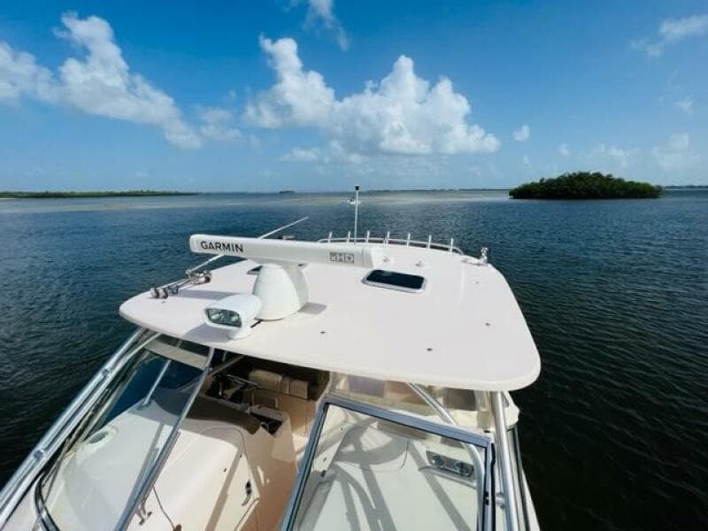 Grady-White Freedom 335 boat on calm waters, clear sky, 2014 model.
