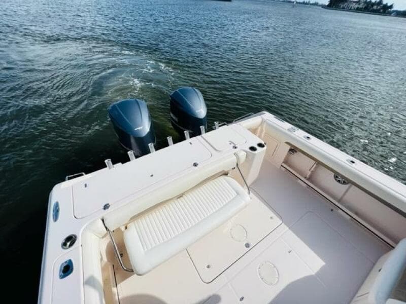 2014 Grady-White Freedom 335 boat with twin outboard motors on water.