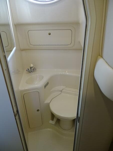 2001 Sea Ray 410 Sundancer bathroom with sink and toilet.