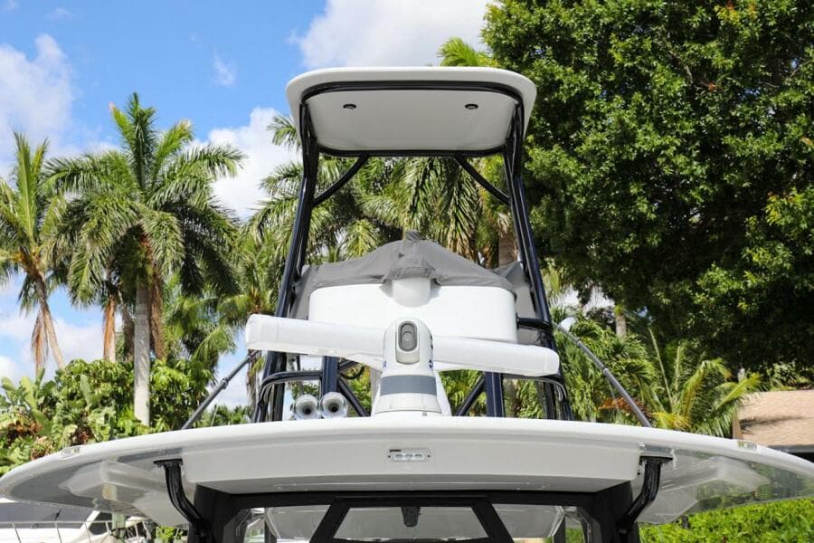 2020 Regulator 41 boat with radar and T-top, surrounded by palm trees.