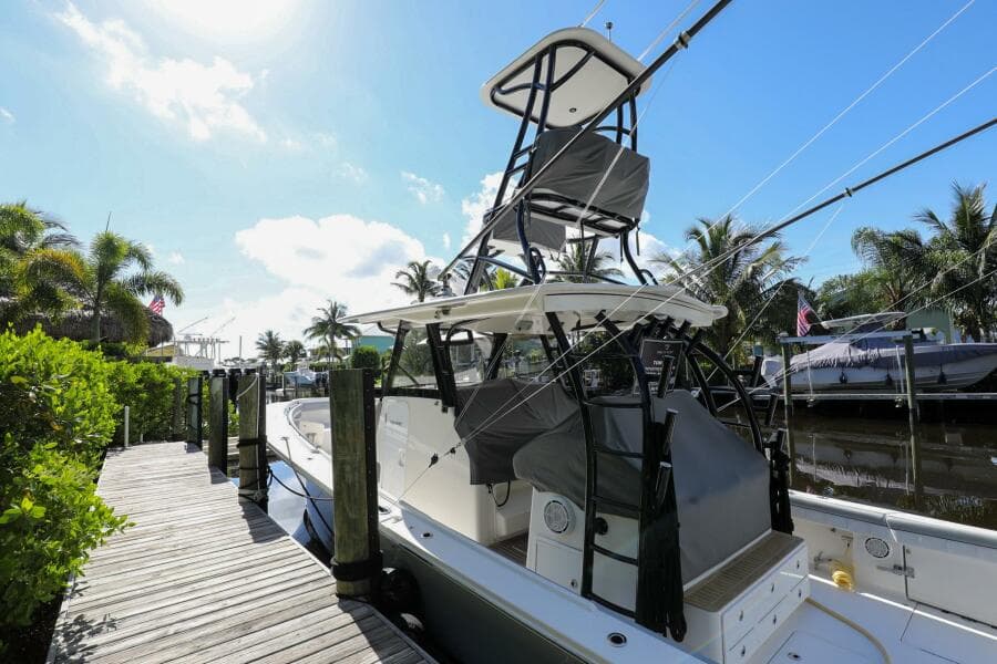 2020 Regulator 41 boat docked at a marina with palm trees in the background.