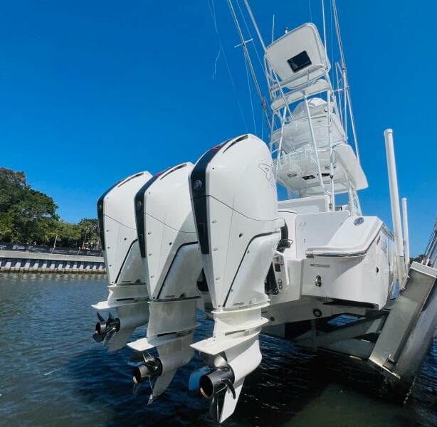 2015 Billfish 39 Custom CC with triple outboard engines on water.