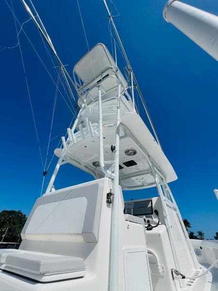 2015 Billfish 39 Custom CC boat with tower against clear blue sky.