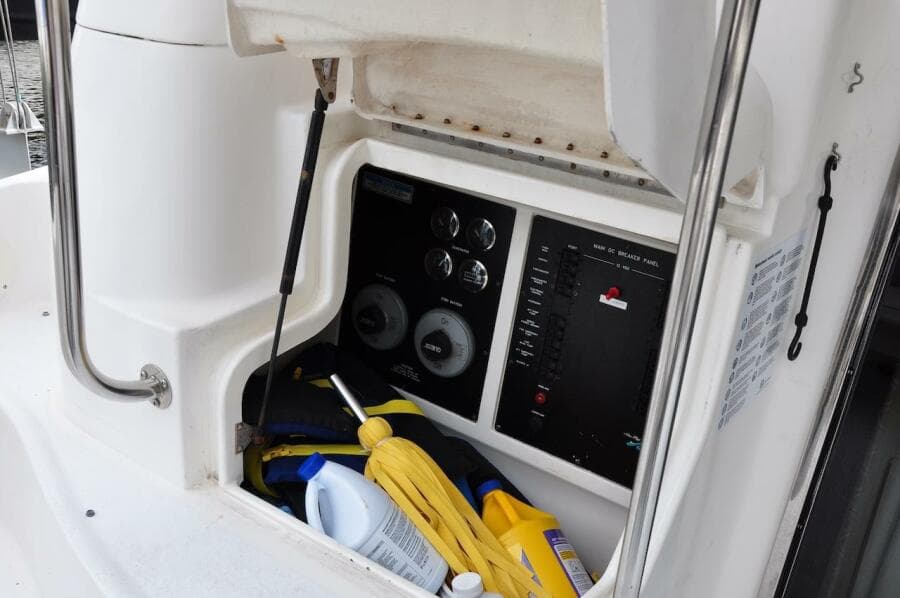 1998 Sea Ray 480 Sedan Bridge control panel and storage compartment.