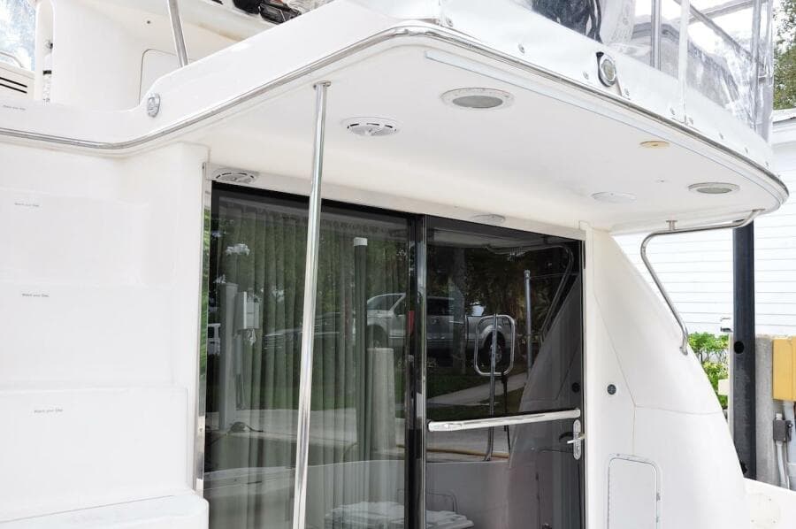 1998 Sea Ray 480 Sedan Bridge yacht, rear deck view with sliding glass door.