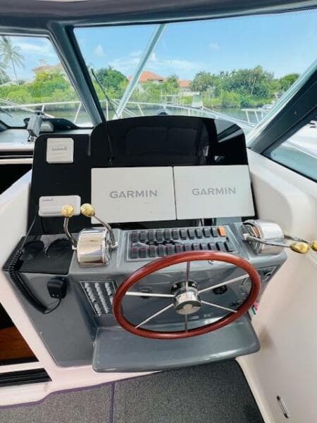 2003 Tiara Yachts 3800 Open helm with Garmin navigation system and dual throttle controls.