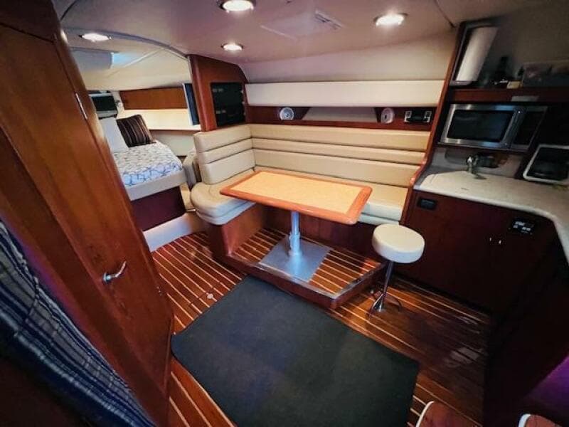 Interior of 2003 Tiara Yachts 3800 Open, featuring cozy seating and modern amenities.