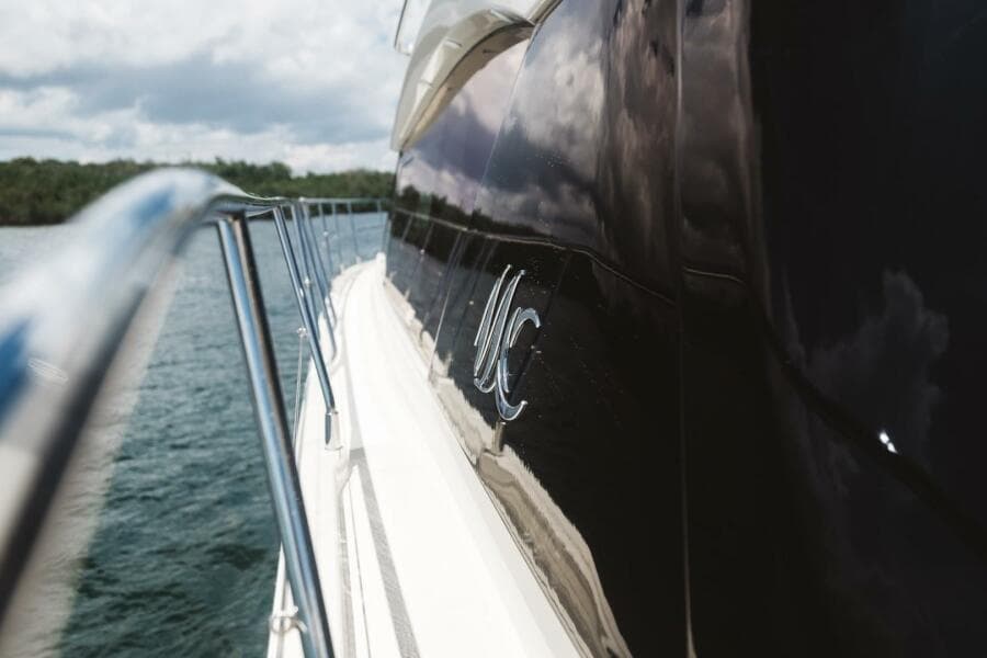 2015 Beneteau Monte Carlo 5 yacht side view on water.