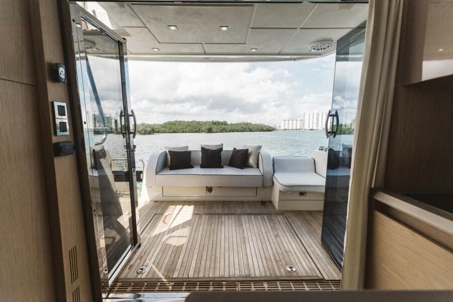 Luxurious 2015 Beneteau Monte Carlo 5 yacht interior with scenic water view.