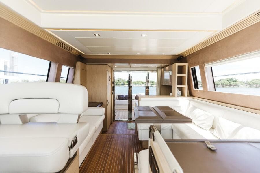 Luxurious interior of 2015 Beneteau Monte Carlo 5 yacht with elegant seating and wood accents.