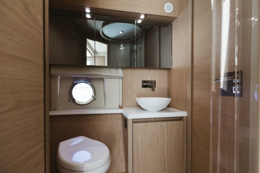 Luxurious bathroom in 2015 Beneteau Monte Carlo 5 yacht with modern fixtures.