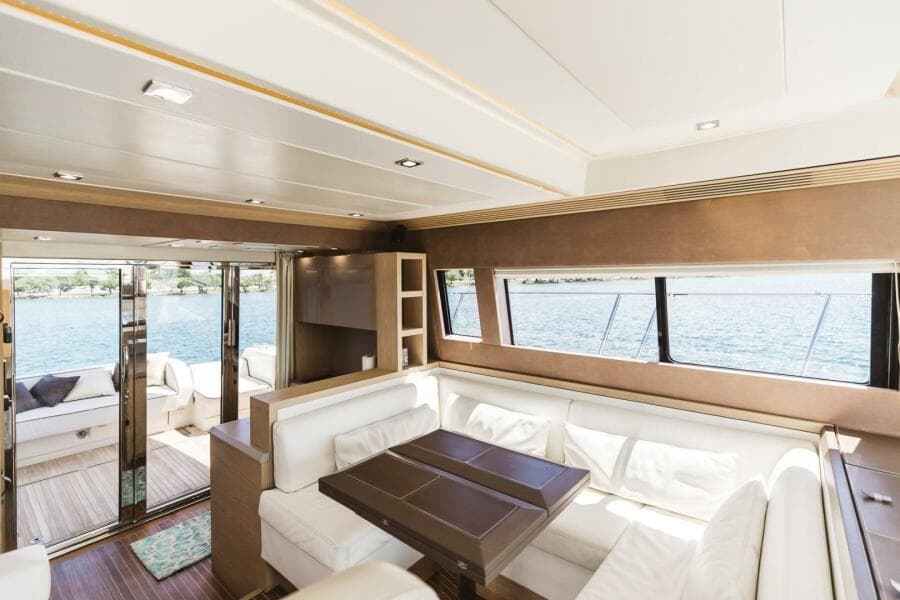 Luxurious interior of 2015 Beneteau Monte Carlo 5 yacht with elegant seating and panoramic windows.